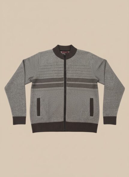 A man wearing a men's grey full zip sweater with dark brown horizontal stripes and dark pants, standing against a neutral background.