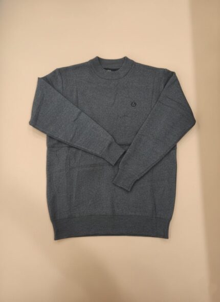 Men's dark grey textured knit crew neck sweater with a small emblem, worn by a man.