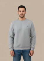 Men's light grey textured crew neck sweater on a model, highlighting the subtle pattern and relaxed fit of the light grey pullover.