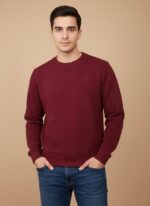 Men's maroon textured crew neck sweater worn by a model, showcasing the fit and subtle pattern of the comfortable garment.