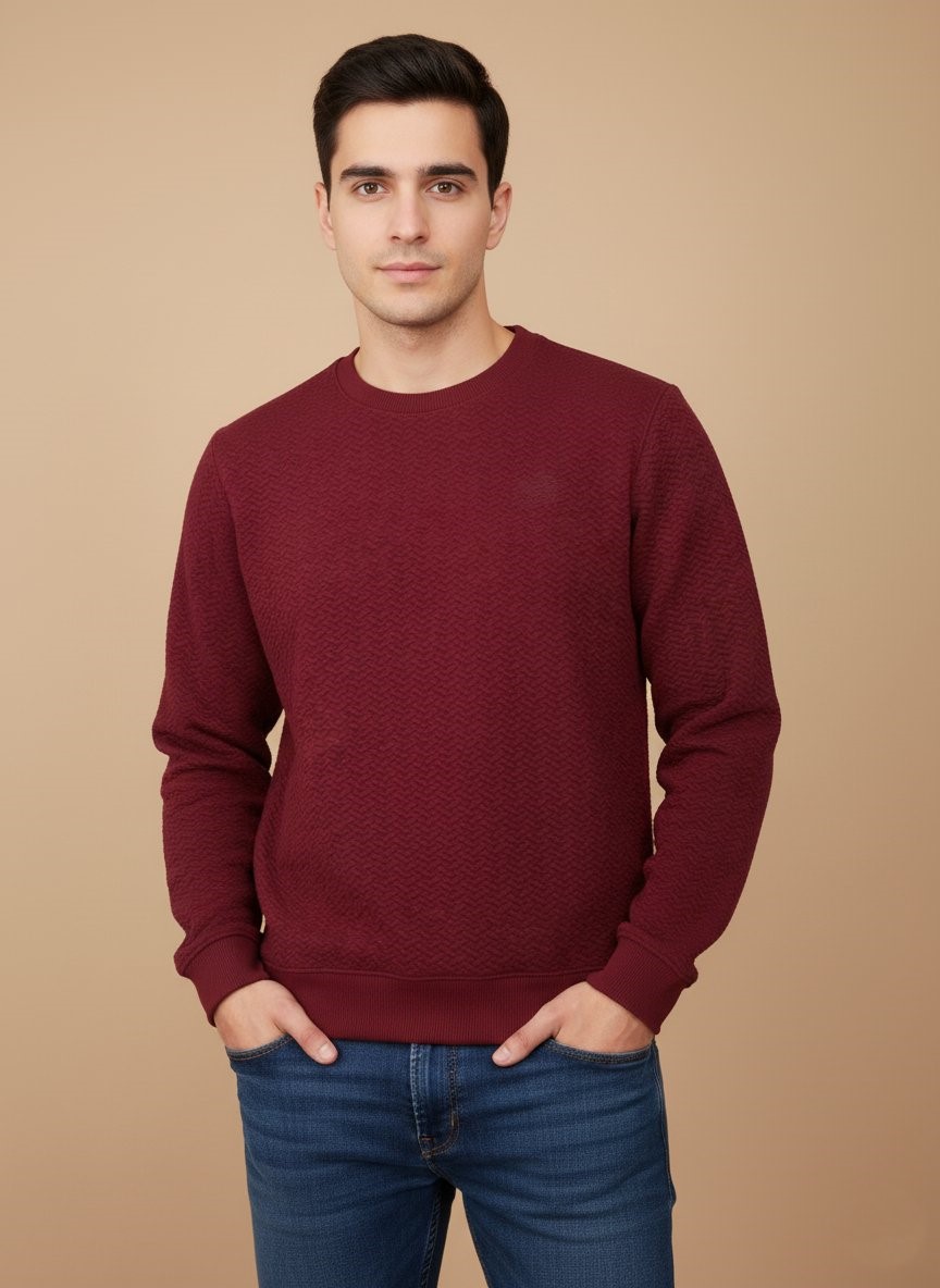 Men's Maroon Textured Crew Neck Sweater Men's maroon textured crew neck sweater worn by a model, showcasing the fit and subtle pattern of the comfortable garment.