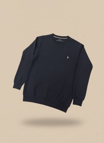 Men's navy textured crew neck sweater with a delicate pattern and a yellow embroidered logo, worn by a model.