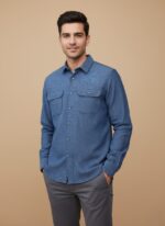 Men's blue flannel shirt, long sleeve, button-up, with two chest pockets, folded on a neutral background.