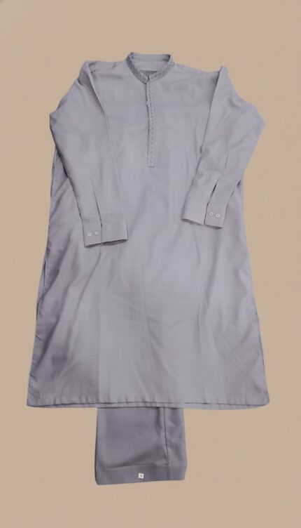 Image of a man wearing a grey embroidered kurta pajama set with detailed neckline.