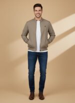 Men's bomber jacket in taupe, dark wash jeans, white t-shirt, brown shoes, full body shot, casual men's fashion