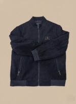 Men's dark corduroy bomber jacket with a front zipper, ribbed collar, cuffs, and hem, and two zippered pockets.