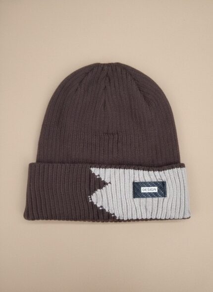 Image of a man wearing a brown and light grey/beige two-tone ribbed beanie with a black "DESIGN" tag on the fold.