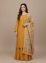 Mustard yellow heavily embroidered chiffon dress unstitched 3 PC fabric and checkered chiffon dupatta laid on a plain background.