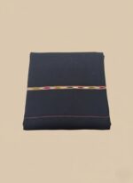 Black men's shawl with colorful embroidered stripe, folded neatly on a light background.