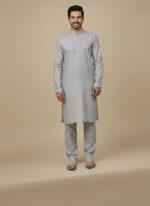 Premium grey fabric roll with a striped edge, high-quality textile for tailoring.