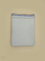 Premium grey fabric roll with a striped edge, high-quality textile for tailoring.