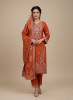 Vibrant orange Khaddar 3 Piece Unstitched Suit with detailed white and maroon embroidery on the shirt and a matching plain bottom and printed dupatta.