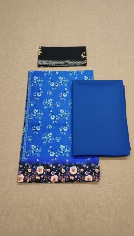 Full-length image of a woman wearing the "RAS BHARI AALAYA" blue digital print winter suit with a black dupatta, showcasing the floral patterns and the elegant fit of this women's winter suit.