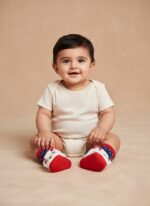 Soft cotton baby socks and booties set for newborns 0–6 months featuring bear slippers and colorful Carter’s socks.