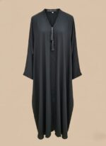 Neutral woman abaya in soft crepe, open-front kimono sweater style, side pockets and belt shown on model against light studio backdrop