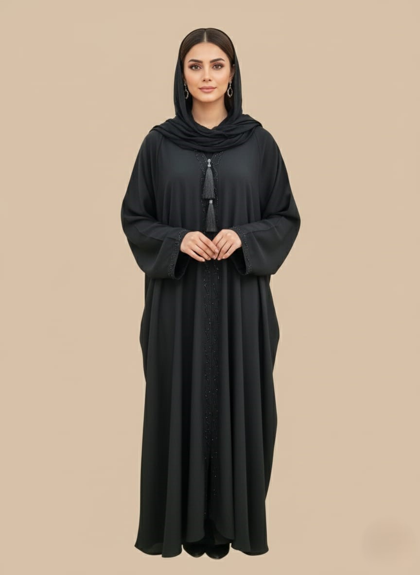 Soft-Flow Woman Abaya Neutral woman abaya in soft crepe, open-front kimono sweater style, side pockets and belt shown on model against light studio backdrop