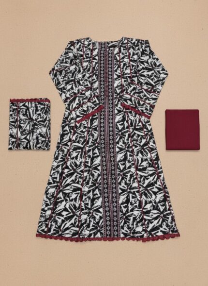 A flat lay showing a black and white abstract printed khaddar kurta with a central design panel, maroon lace trim, and a folded matching printed khaddar dupatta.