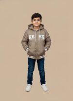 Tan hooded puffer jacket for boys with white "NE SK" lettering on the front, ribbed striped cuffs, and a button closure.