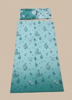 A flat lay showing a teal floral printed lawn suit with a shirt piece and a folded matching dupatta. The fabric features an ombre transition from light to dark teal with white floral patterns.