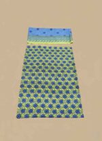 A 3-piece set of unstitched Lawn Suit fabric. The shirt piece is yellow with blue floral block prints. The dupatta piece is light blue with a patterned border. The third piece is folded underneath.