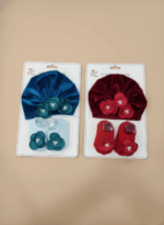 Velvet baby cap and booties set with flower design in red and teal blue for newborns and infants.