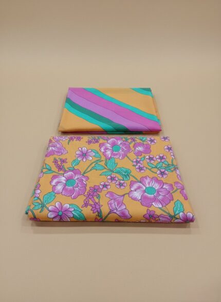3 PC unstitched lawn fabric with floral and striped patterns on an orange background,