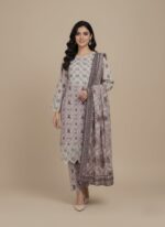 Full-length image of a woman wearing a light beige and maroon Women's Printed Suit with intricate traditional patterns on the long-sleeve tunic and trousers, and a matching printed dupatta.