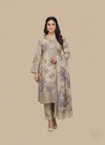 Full-length image of a woman wearing a light beige Women's Floral Suit with an all-over floral printed long-sleeve tunic featuring an embellished neckline and cuffs, matching patterned trousers, and a printed dupatta