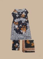 Full-length image of a woman wearing a black Women's Floral Suit with orange and white floral prints and white embroidery on the tunic, matching patterned trousers, and a black dupatta with an orange border.