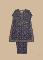 Full-length image of a woman wearing a navy blue Women's Floral Suit with an all-over floral and geometric printed long-sleeve tunic featuring an embellished neckline, and matching patterned trousers.