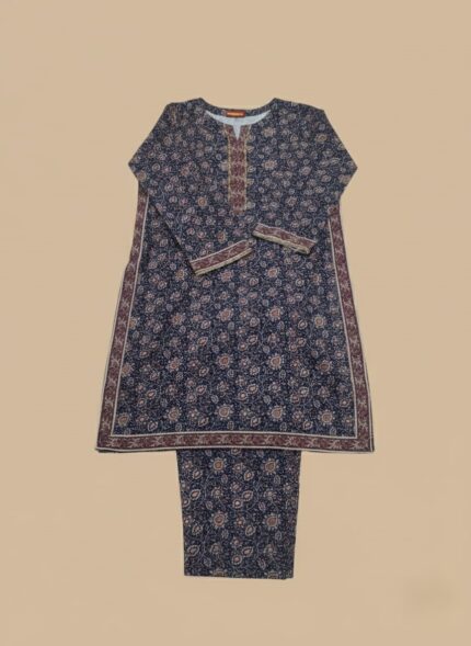 Full-length image of a woman wearing a navy blue Women's Floral Suit with an all-over floral and geometric printed long-sleeve tunic featuring an embellished neckline, and matching patterned trousers.