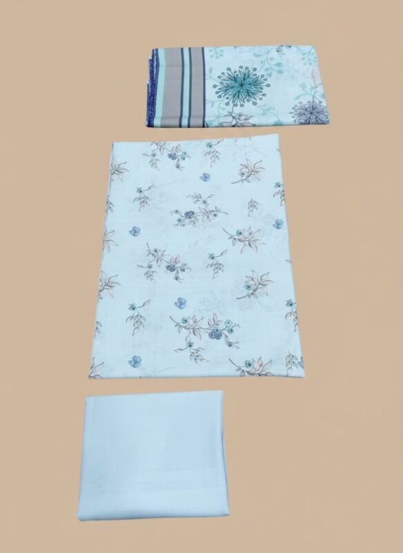 Close-up of a neatly folded three-piece wool unstitched suit fabric in blue floral print and plain blue, laid out on a beige background.