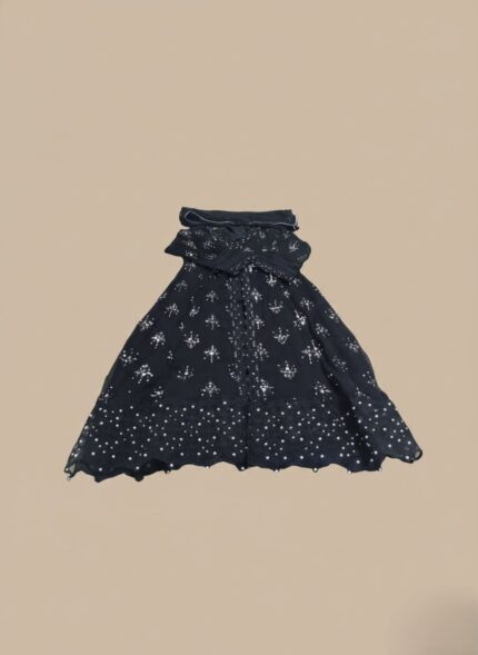 Women's embellished maxi dress with intricate silver detailing and a long, flowing design, folded on a light background.