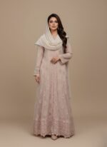 Women's embellished maxi dress with intricate silver detailing and a long, flowing design, folded on a light background.