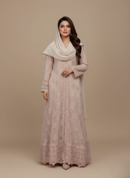 Women's embellished maxi dress with intricate silver detailing and a long, flowing design, folded on a light background.