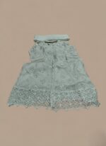 Women's embellished maxi dress with intricate silver detailing and a long, flowing design, folded on a light background.