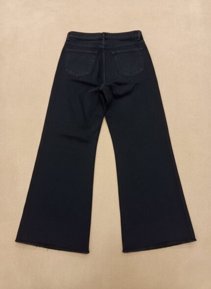 Back view of women's black flared jeans, high-waisted with a wide leg.