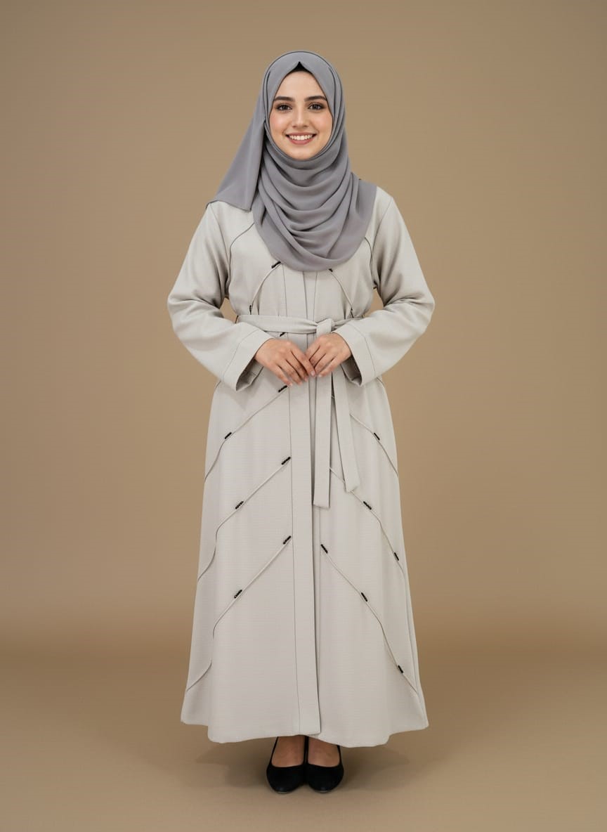 Elegant Grey Modest Abaya Dress with Belted Waist Elegant grey modest abaya dress with belted waist and intricate stitching, modeled by a smiling woman. A chic Islamic sweater for modern modest fashion.