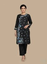 Women's black 2 piece hand painted cotton suit with white floral artClose-up of blue and white hand-painted heart motifs on black cottonFront view of black 2 pc suit with hand-painted vine design and Artisan-made hand-painted cotton suit for women in Pakistan pipingBlack cotton shirt and trouser set with unique hand-painted floral borders2 pc hand painted cotton suit Pakistan