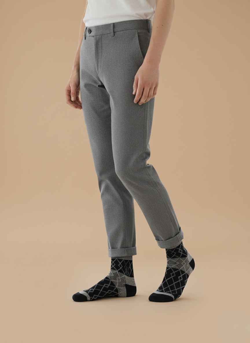 Main Image: Pair of Gelani's woolen winter socks in dark packaging on a blue background. Detail Shot: Close-up of black woolen texture and stitching pattern on men's winter socks. Packaging Shot: Two packs of Bodymax and Gelani style winter socks showing labels and branding. Angle View: Side view of folded black winter socks showing thickness and fabric quality. Lifestyle/Flatlay: Flat lay of men's dark colored socks ready for winter wear. Black Socks for Men