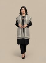 Maroon women cap shawl with geometric border, knit cape-style winter wrap.