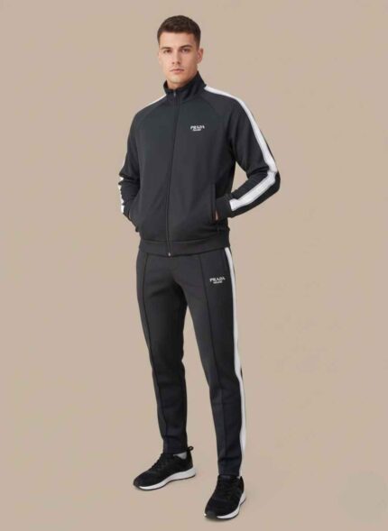 A high-quality image of a black two-piece designer tracksuit set featuring prominent white stripes on the sleeves and legs.