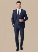 Gelani's navy blue 3pc dress suit for men with matching waistcoat Chocolate brown stitched tropical fabric three piece suit for men Formal black 3pc dress suit for men winter collection by Gelani's Back view of professionally stitched formal trousers and blazer for men Premium tropical fabric detail on men's three piece formal suit 3pc dress suit for men