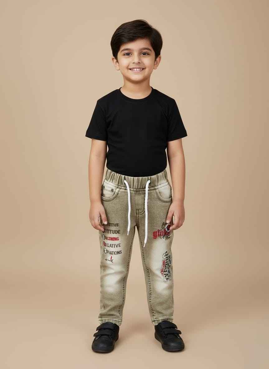 Kids Boy Green Denim Jeans in Pakistan Close-up of Kids Boy Green Denim Jeans with stitch design and white drawstring detail.Full shot of Gelani Kids Boy Green Jeans on a neutral background. Detail view of the stitch and embroidered graphic on the left leg of the children's jeans. View of the back pockets and durable denim texture of the boy's green jeans .Kids boy's winter fashion denim jeans in green with elastic waist.