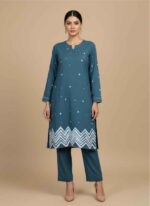 Gray 2 piece cotton suit for women with pink hand painted floral art.Close up of hand painted pink bow and lavender flowers on gray fabric.Pakistani artisan hand painted cotton kameez and trouser set in gray.Elegant women's gray cotton outfit with magenta piping and floral motifs.Handcrafted floral hand painting on premium light gray hand painted cotton suit pakistan shirt.