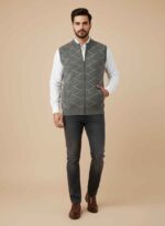 Main Image: Front view of Gelani's DARK GRAY sweater for men featuring a white geometric diamond stitched pattern. Detail Shot: Close-up of the intricate white pinstripe and chevron stitching on the dark gray wool vest. Collar Detail: High-neck ribbed collar and central zipper detail of the men's dark gray winter sweater. Fit View: Sleeveless design and ribbed armhole construction of the Gelani's dark gray woolen sweater. Texture Shot: High-quality wool fabric and side pocket detail of the stitched DARK GRAY sweater for men.