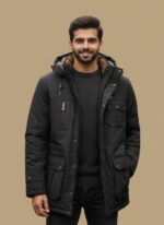 Main View: Gelani's dark gray jacket for men featuring a heavy winter parka design with a fur-lined hood. Detail View: Close-up of the multi-pocket utility system and arm pocket on the dark gray winter jacket. Interior View: Soft faux fur lining inside the hood of the premium men's dark gray parka. Closure Detail: Central zipper with a buttoned storm flap on the stitched winter jacket for men. Cuff Detail: Adjustable buttoned cuffs and reinforced stitching on the dark gray heavy-duty parka. dark gray jacket for men