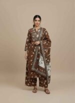 Main Display: Gelani's brown 3pc unstitched khaddar suit with floral printed shirt and dupatta. Pattern Detail: Close-up of white and beige floral motifs on a rich brown khaddar fabric shirt piece. Dupatta View: Fully printed winter khaddar dupatta with decorative floral borders in brown and cream. Fabric Texture: High-quality unstitched khaddar trouser and shirt fabric showing the characteristic winter weave. Complete Set: Overhead view of the brown floral 3-piece winter collection for women by Gelani's. 3pc unstitched khaddar suit