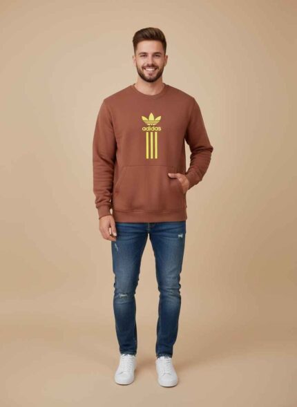 Adidas rust brown wool sweater for men front view on a plain background. Close up of the stitched neckline and texture of a men's wool winter sweater. Stylish rust brown sweater for men showing the free size fit and sleeve detail. Adidas winter collection wool sweater for men displayed for a clothing website. Detail shot of the premium wool fabric used in the Adidas men's winter sweater. whool sweater for men