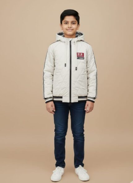 Dark blue or black luxury knit beanie with an intricate cable pattern and a gold Medusa head emblem on the ribbed cuff.